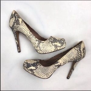 Vince Camuto leather snakeskin pumps.